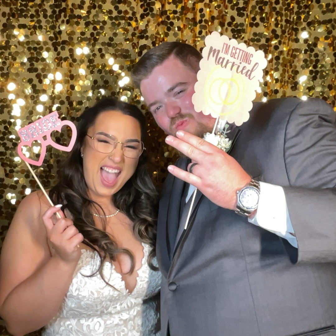 Wedding guests using a photo booth at Country N Lace