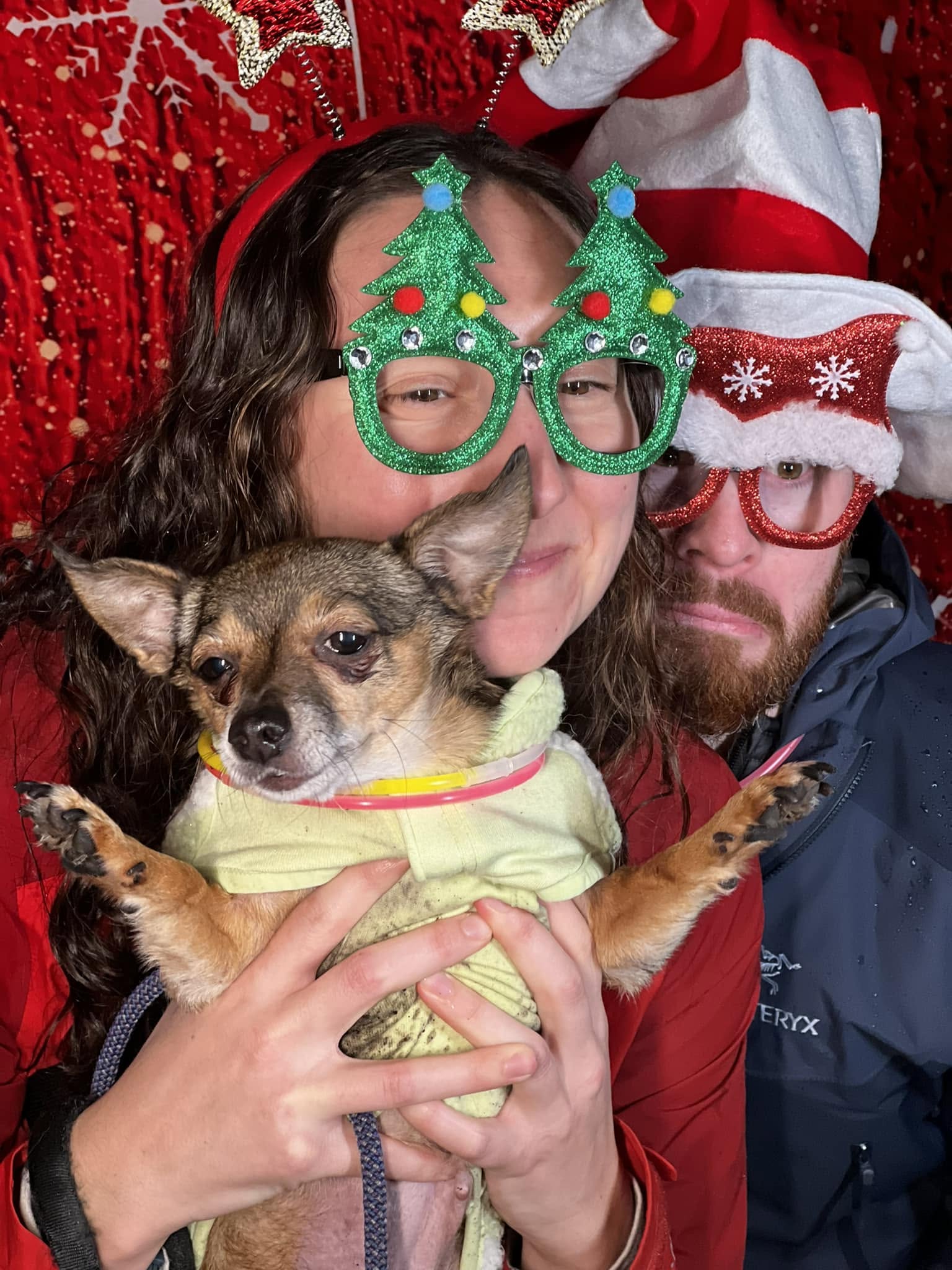 Guests having fun with a holiday party photo booth