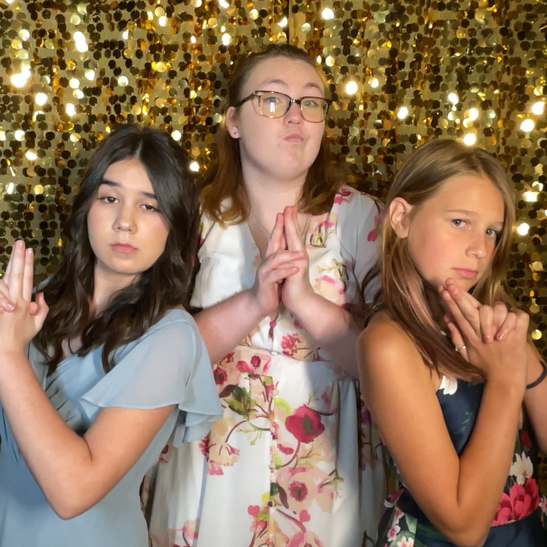 Kids using the photo booth at Country N Lace in Toledo Washington