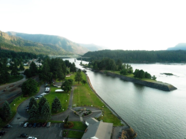 Drone video still over Cascade Locks, Oregon, with the Bridge of the Gods in the background